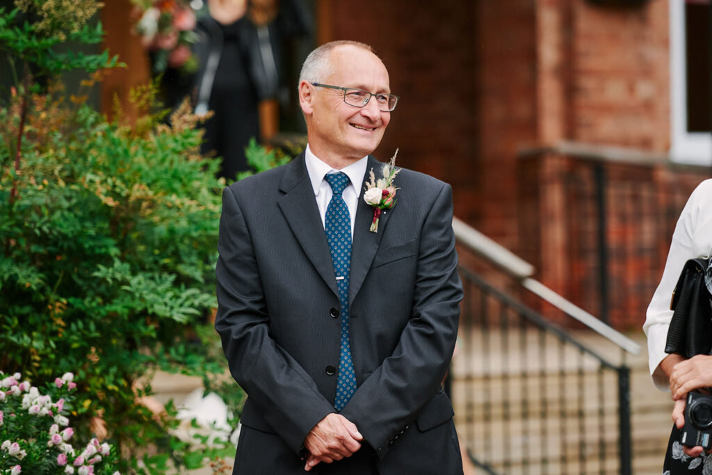 Wedding guests watching the couple after a small Nottingham wedding ceremony
