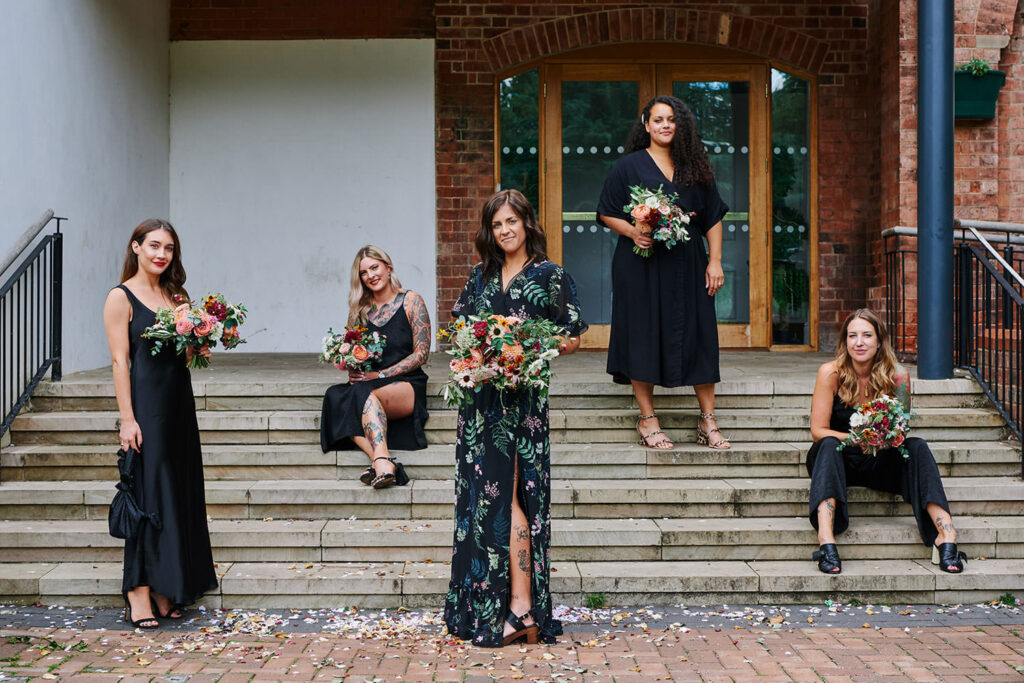 Bridesmaids holding colourful bouquets outside a Nottingham registry office