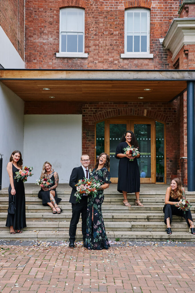 Alternative wedding group portrait outside a Nottingham registry office