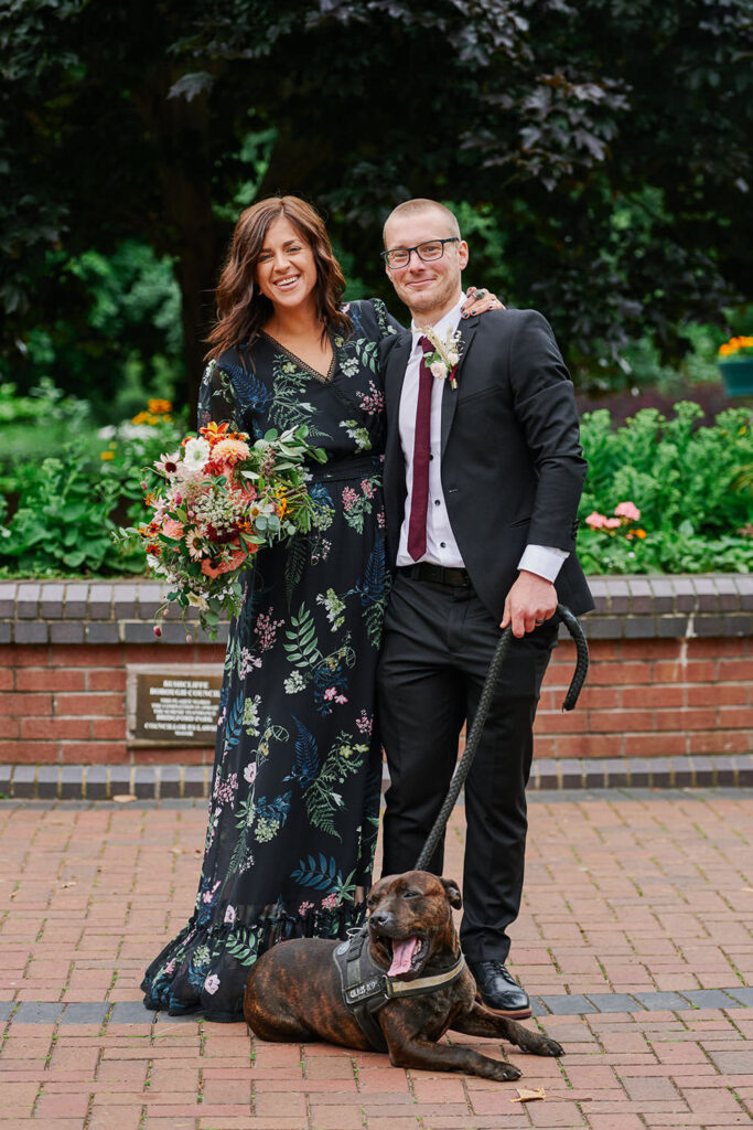 Couple with their dog during alternative wedding portraits in West Bridgford Park