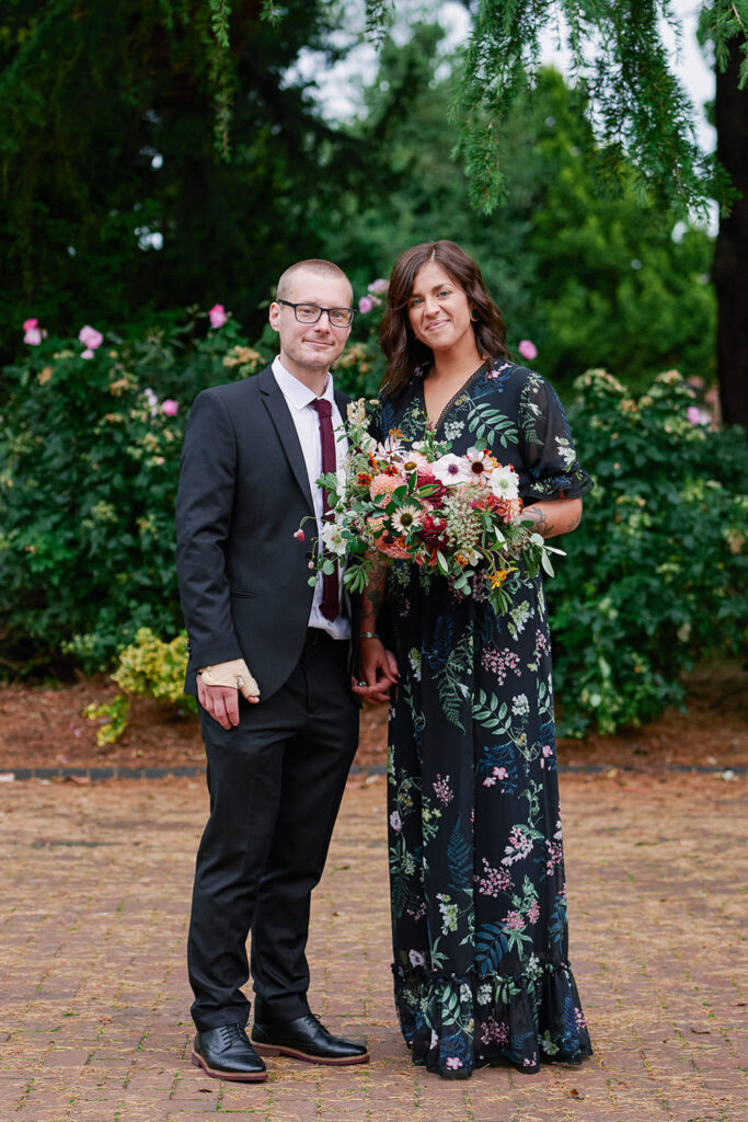 Bride and groom portrait with colourful bouquet during an alternative Nottingham wedding