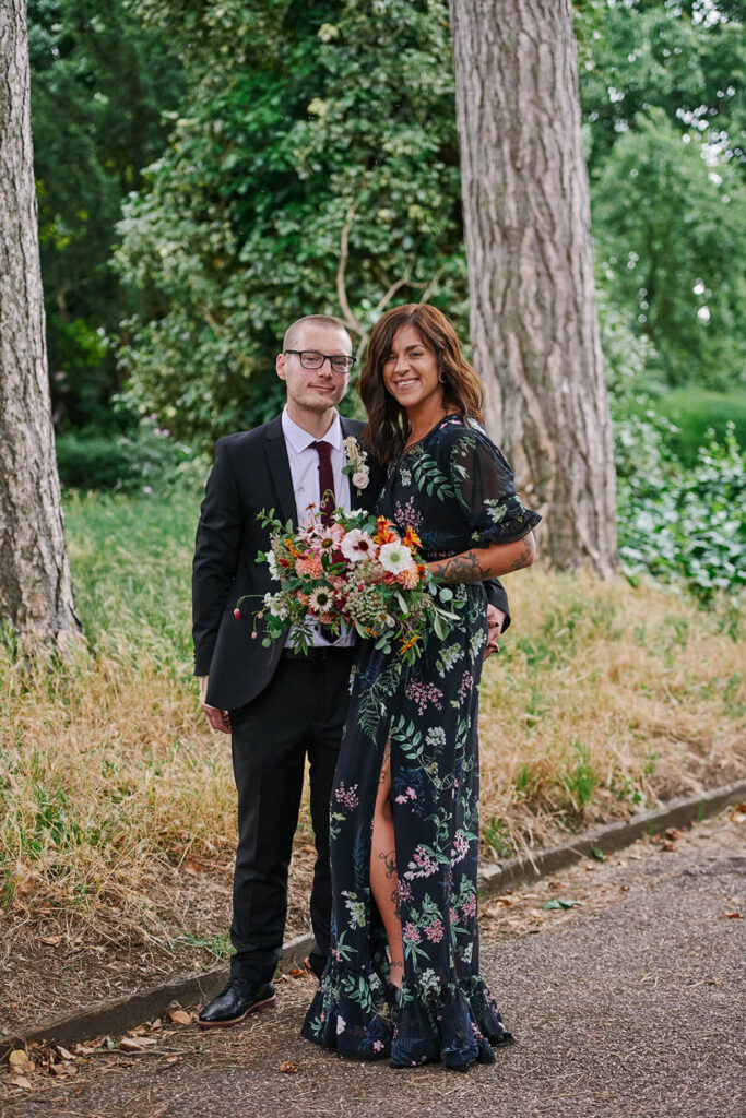 Bride and groom portrait with colourful bouquet during an alternative Nottingham wedding