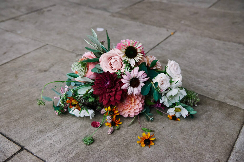 Colourful alternative wedding bouquet with dahlias and wildflowers