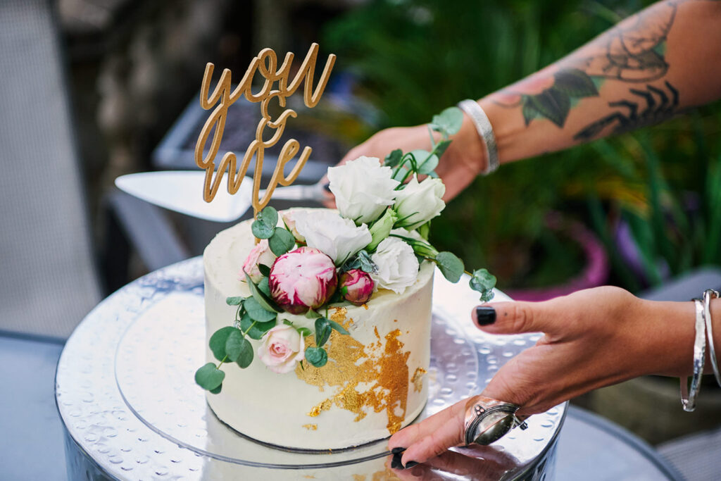 Small floral wedding cake at an intimate Nottingham wedding reception