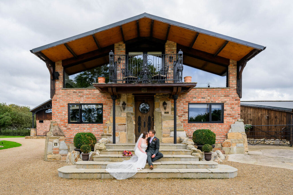 Bride and groom portrait outside Willow Marsh Farm wedding venue in Nottinghamshire