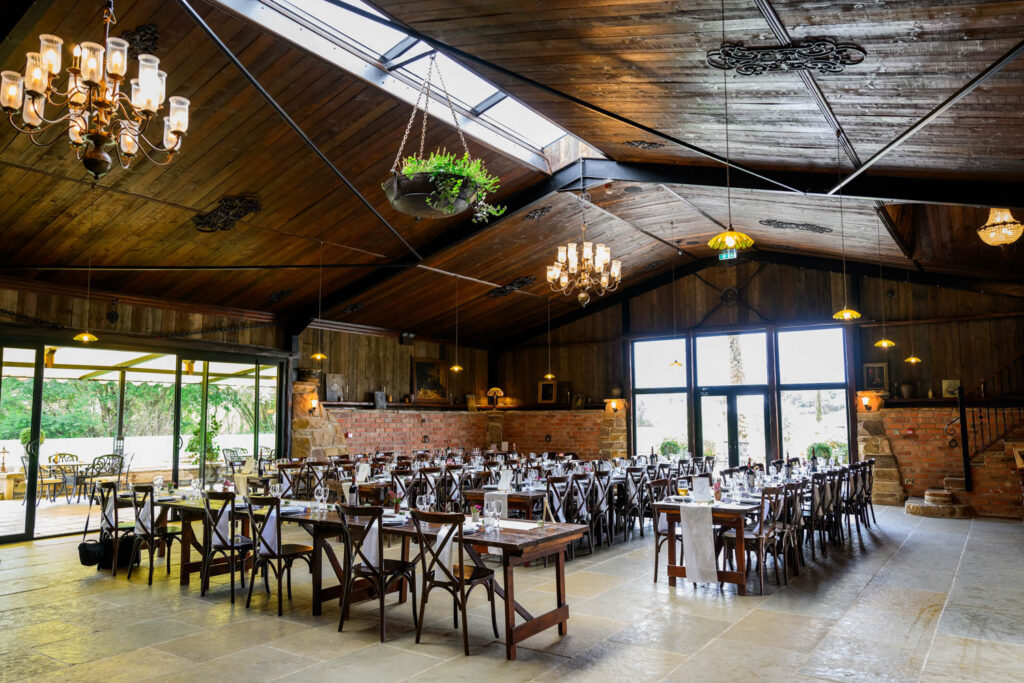 Wedding breakfast setup inside Willow Marsh Farm barn reception space