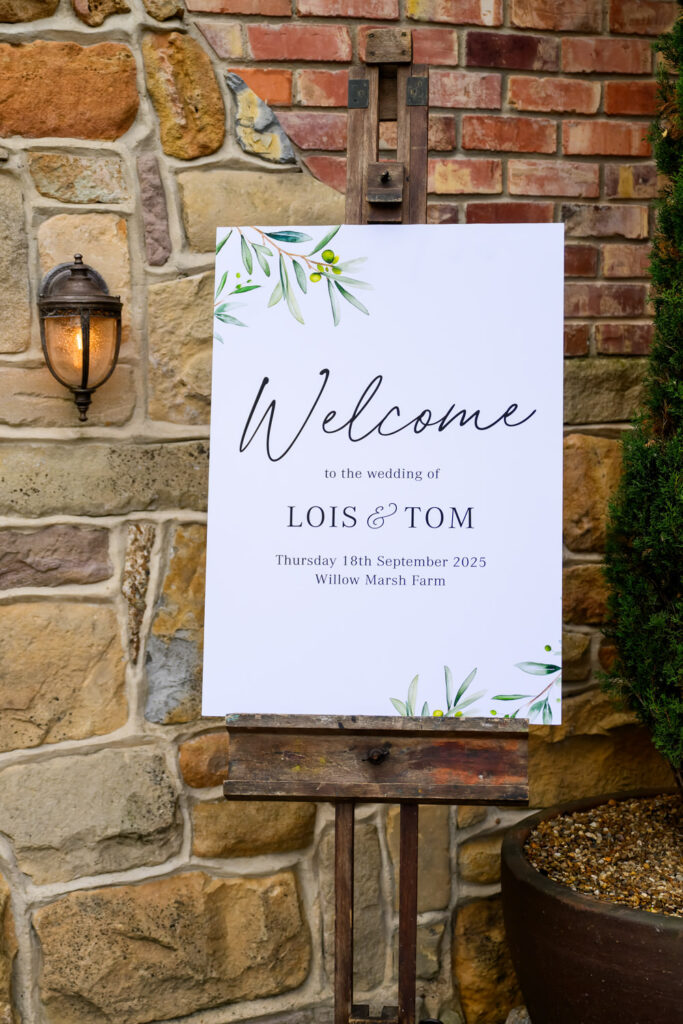 Welcome sign for Lois and Tom’s Willow Marsh Farm wedding with olive green wedding styling