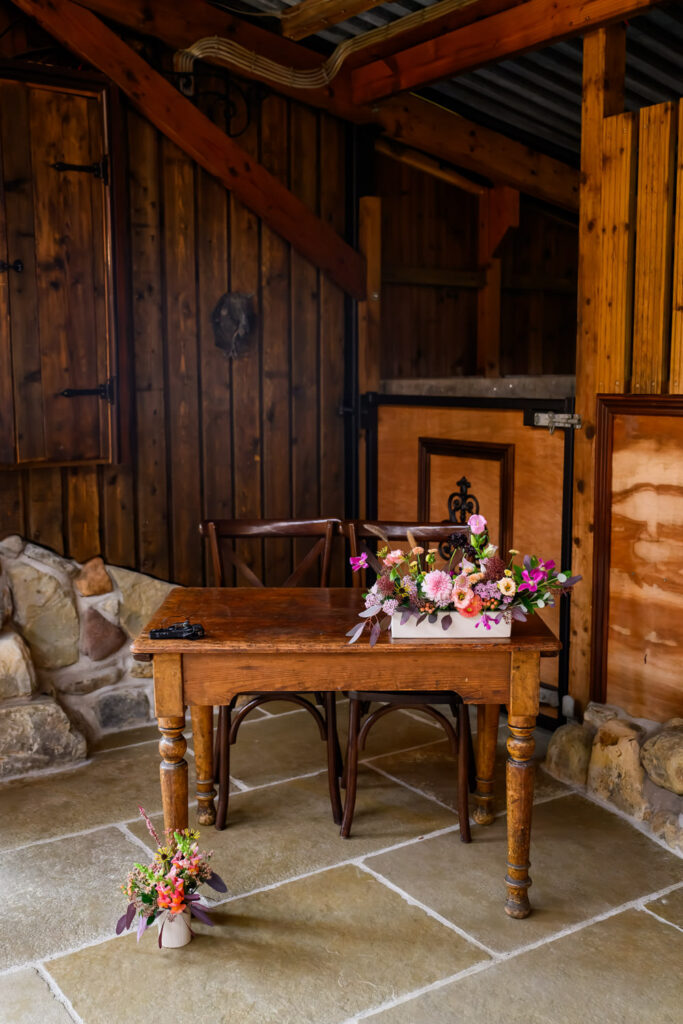Wedding ceremony signing table inside the rustic barn at Willow Marsh Farm