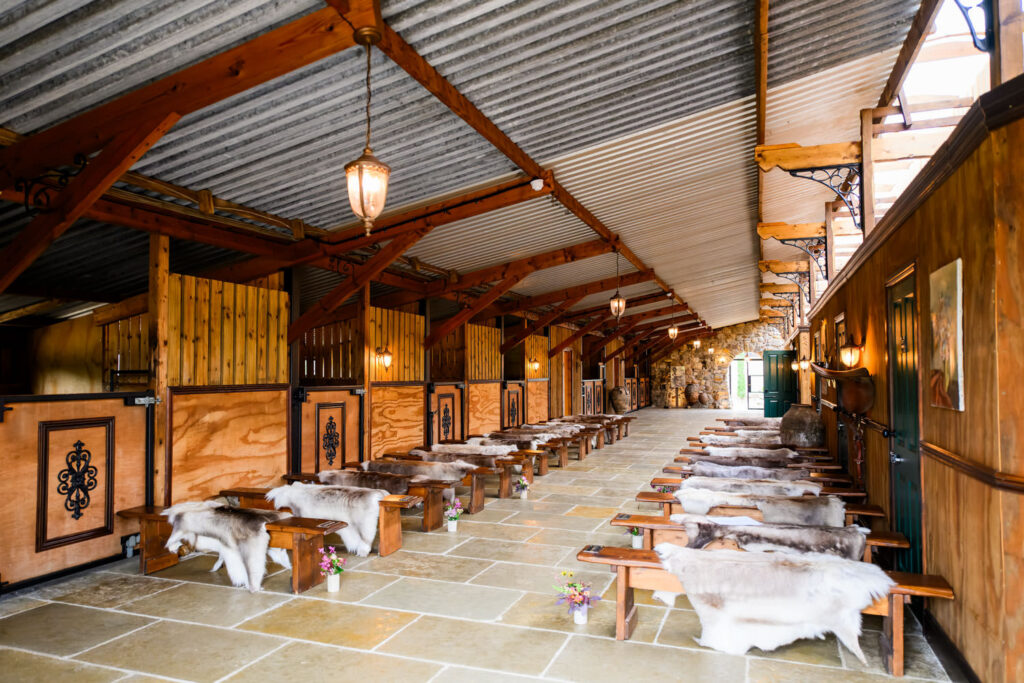 Wide view of the barn ceremony space prepared for a Willow Marsh Farm wedding