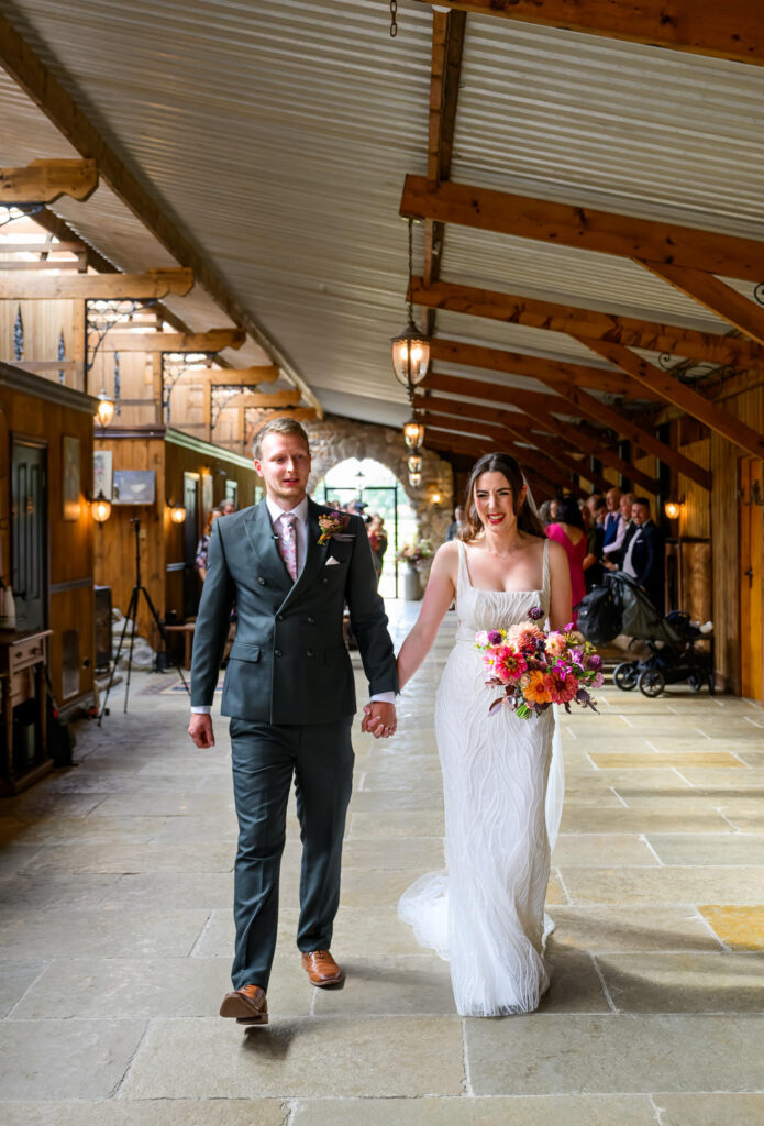 Bride and groom walking back down the aisle after their wedding ceremony
