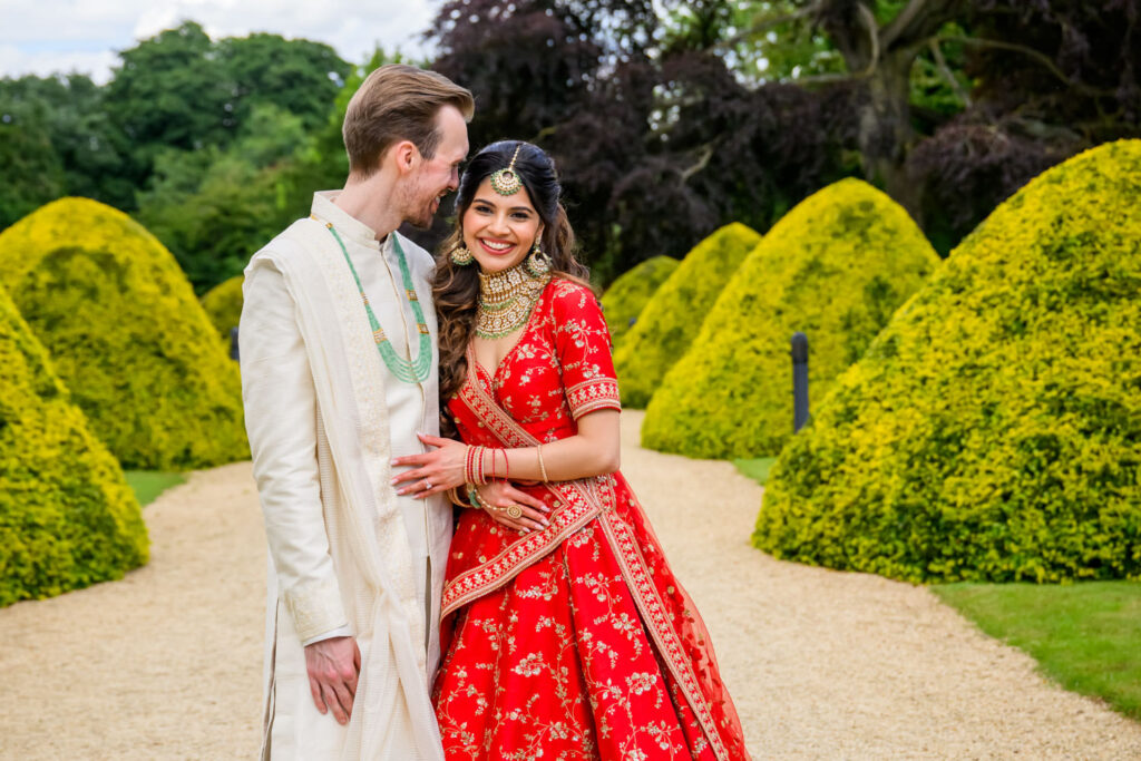 Romantic wedding photography of the couple embracing in the courtyard.