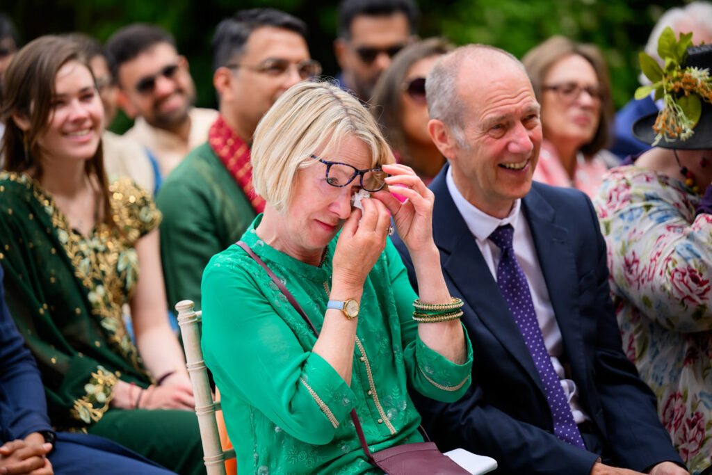 Emotional reaction from wedding guests during the Manor by the Lake ceremony.