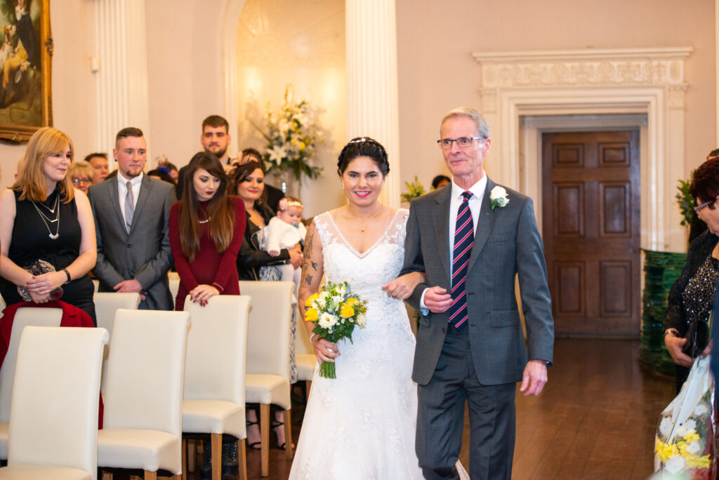 Bride walking down the aisle at Colwick Hall wedding venue
