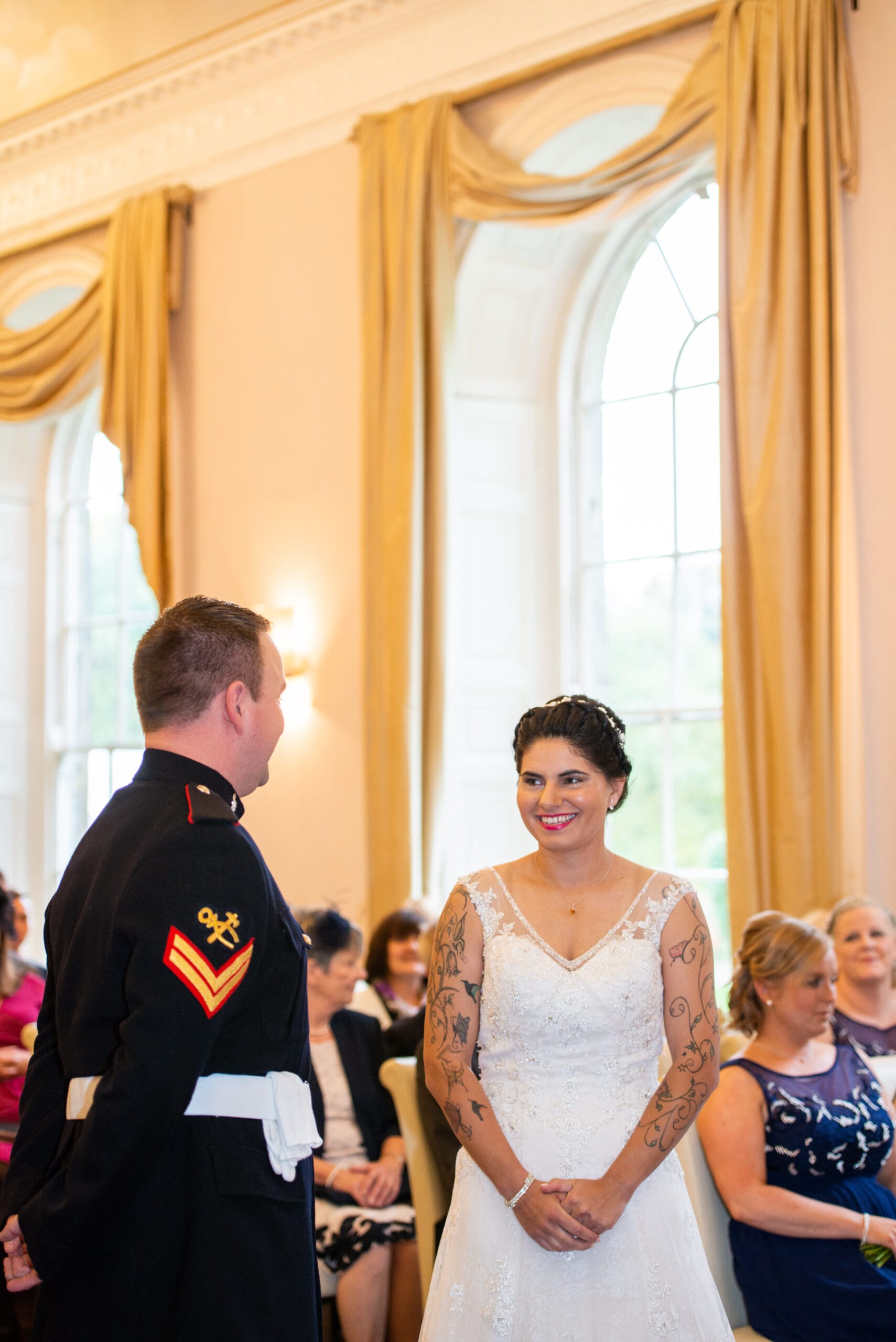 bride smiling during wedding ceremony at Colwick Hall Hotel in Nottinghamshire
