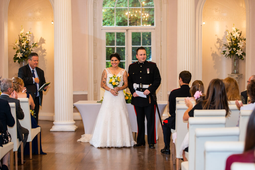 bride & groom smiling during Colwick Hall wedding ceremony