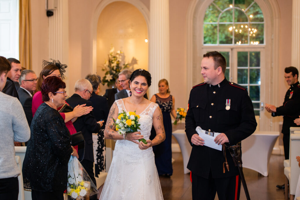 bride & groom walking down aisle at Colwick Hall Hotel