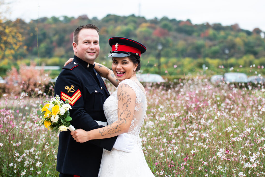 bride and groom smiling outside at Colwick Hall Hotel