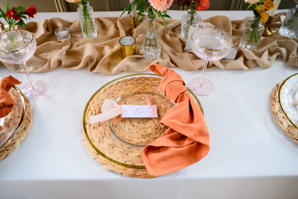Rustic table set up with colourful napkins at Carriage Hall wedding venue