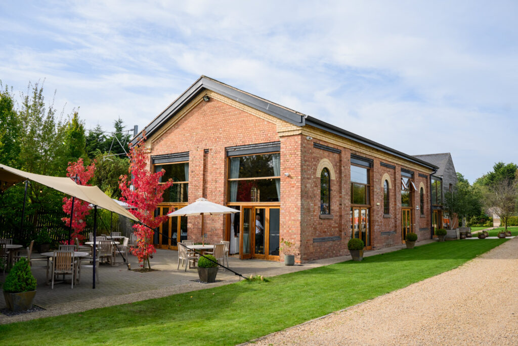Wedding photography featuring Carriage Hall wedding venue on sunny day
