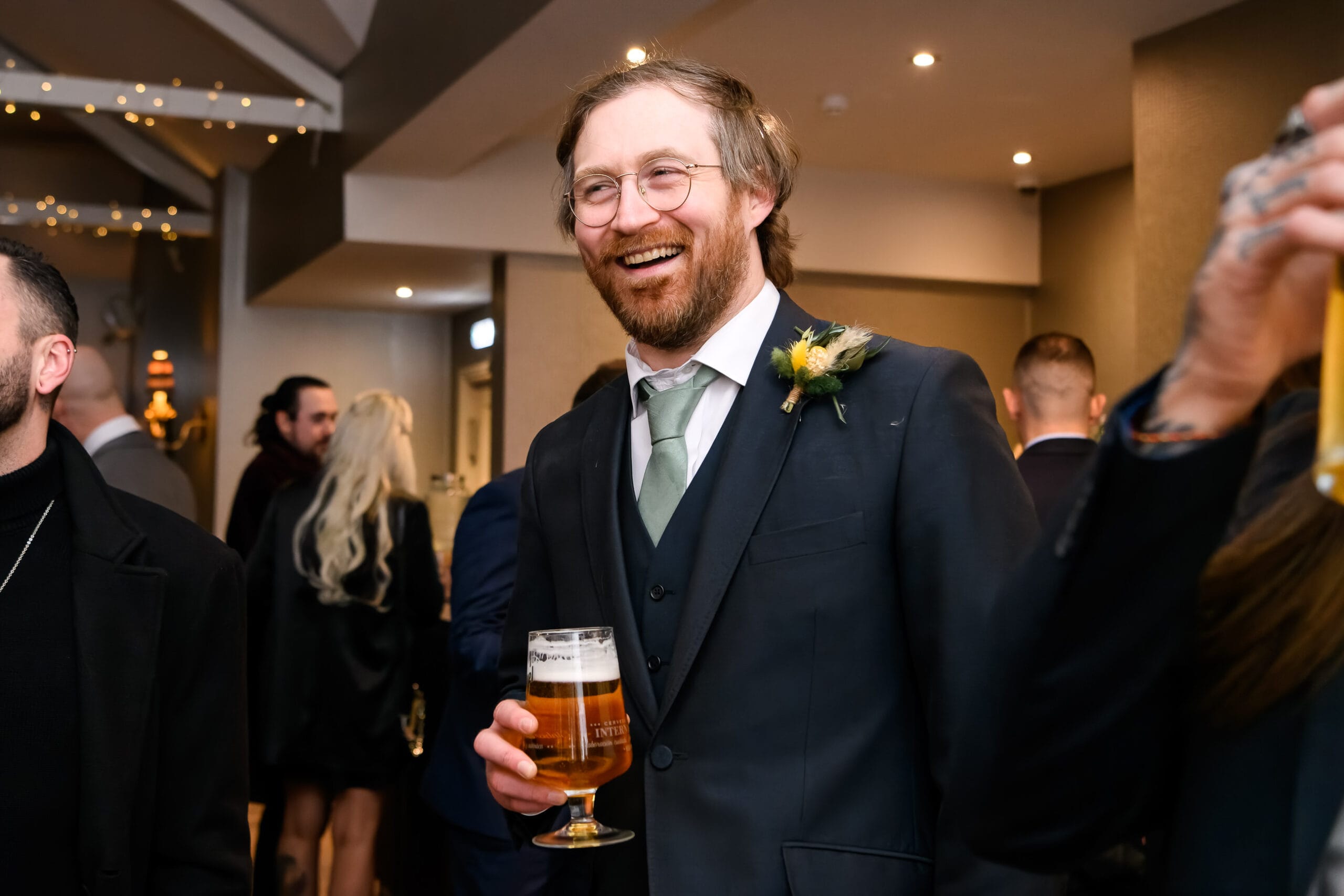 happy wedding guest laughing during evening reception at Cockliffe country house