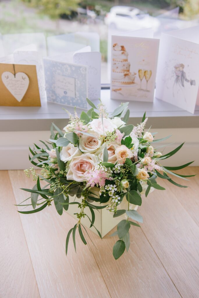 wedding flower bouquet in front of wedding card