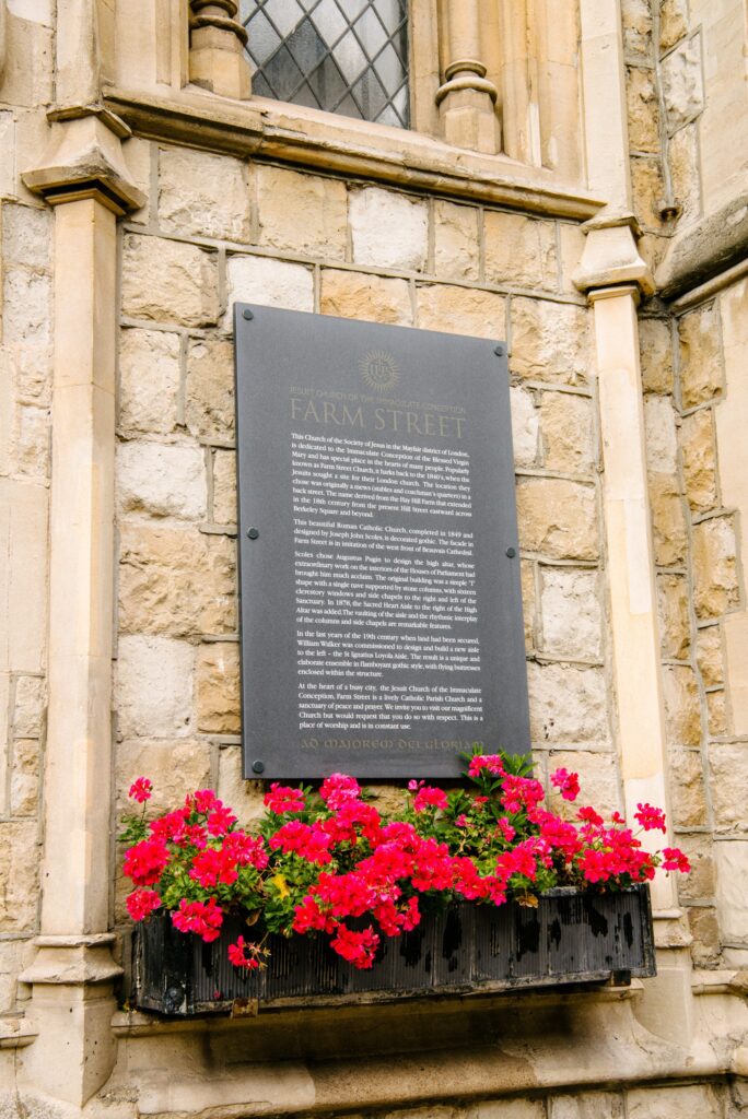 interior shot of Farm Street Church wall plaque in Mayfair