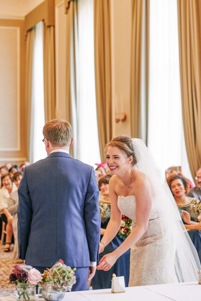 bride and groom smiling during their fun winter ceremony