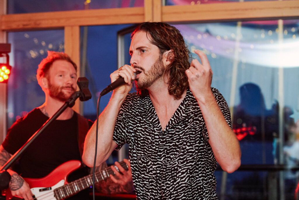 Singer performing during Greenwich Yacht Club wedding in The River Rooms
