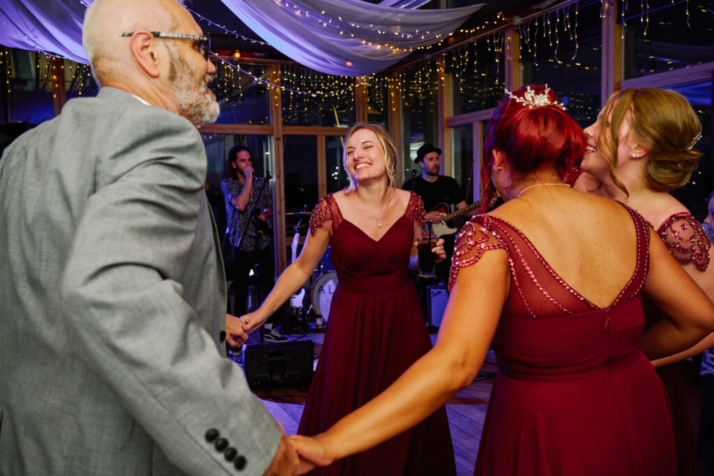 Wedding guests dancing at Greenwich Yacht Club in The River Rooms