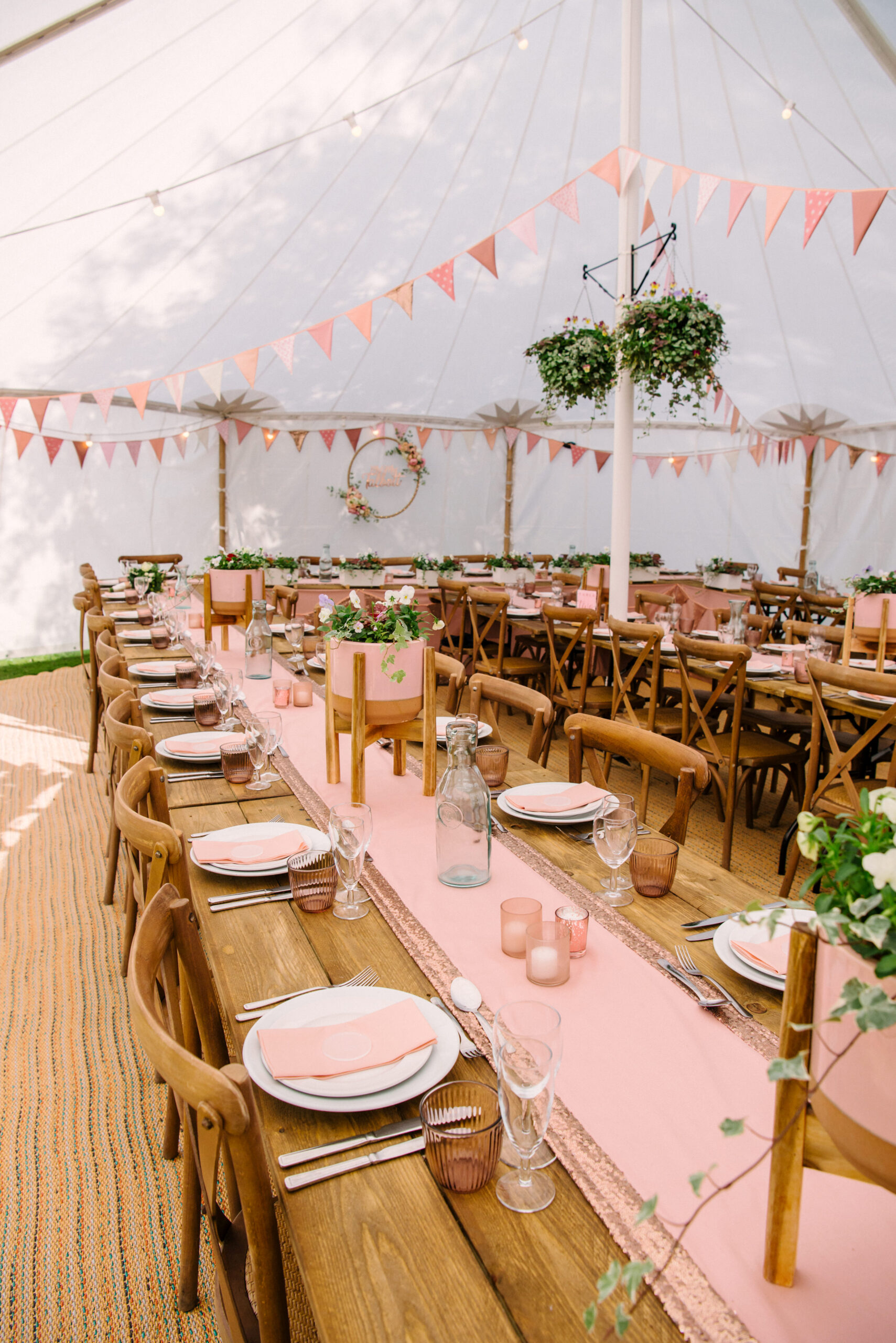 Wedding marquee with pink table details at Halliford Mere Lakes