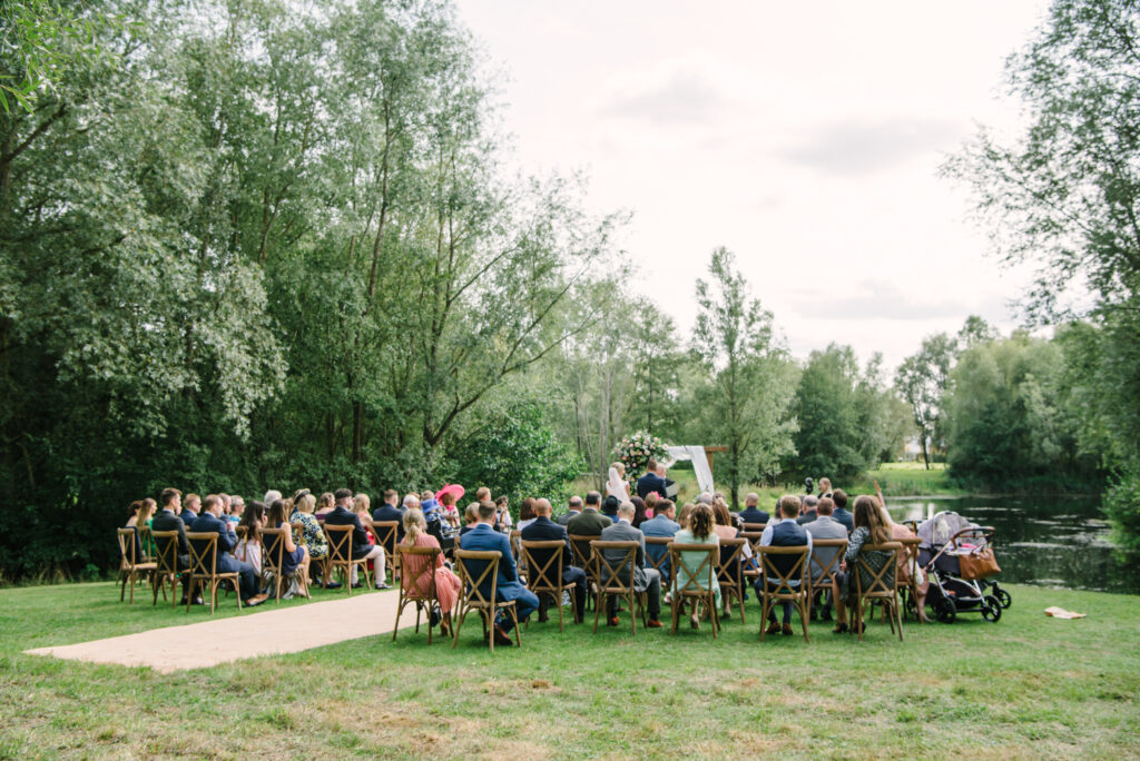 Outdoor lakeside ceremony at Halliford Mere Lakes wedding venue