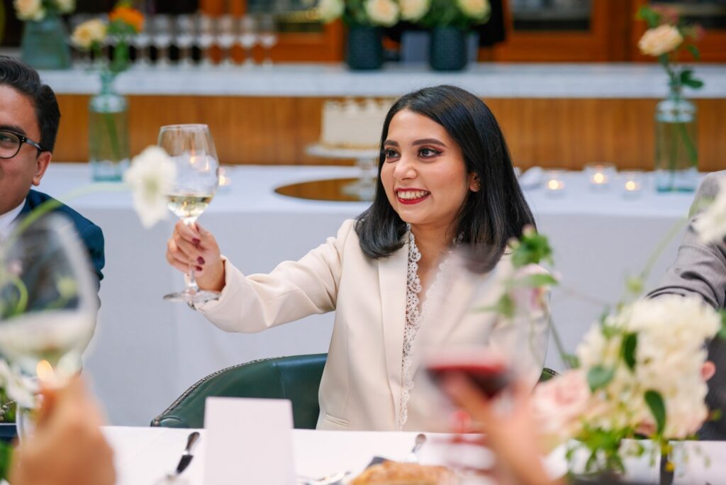 Happy bride toasting wedding speeches at The Bluebird in Chelsea