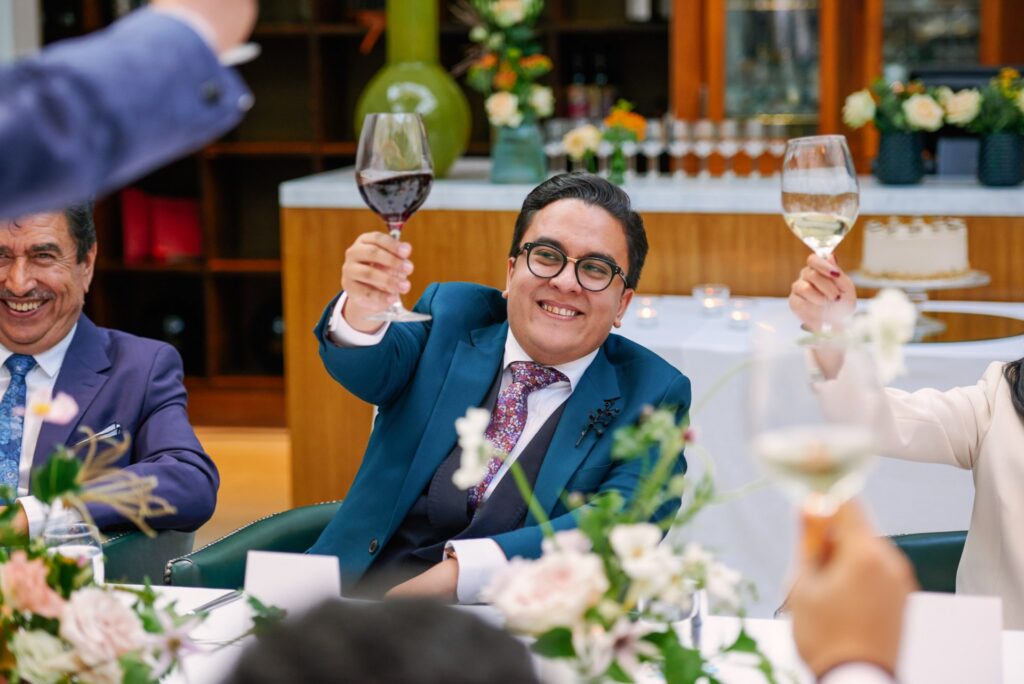 Happy groom toasting wedding speeches at The Bluebird in Chelsea