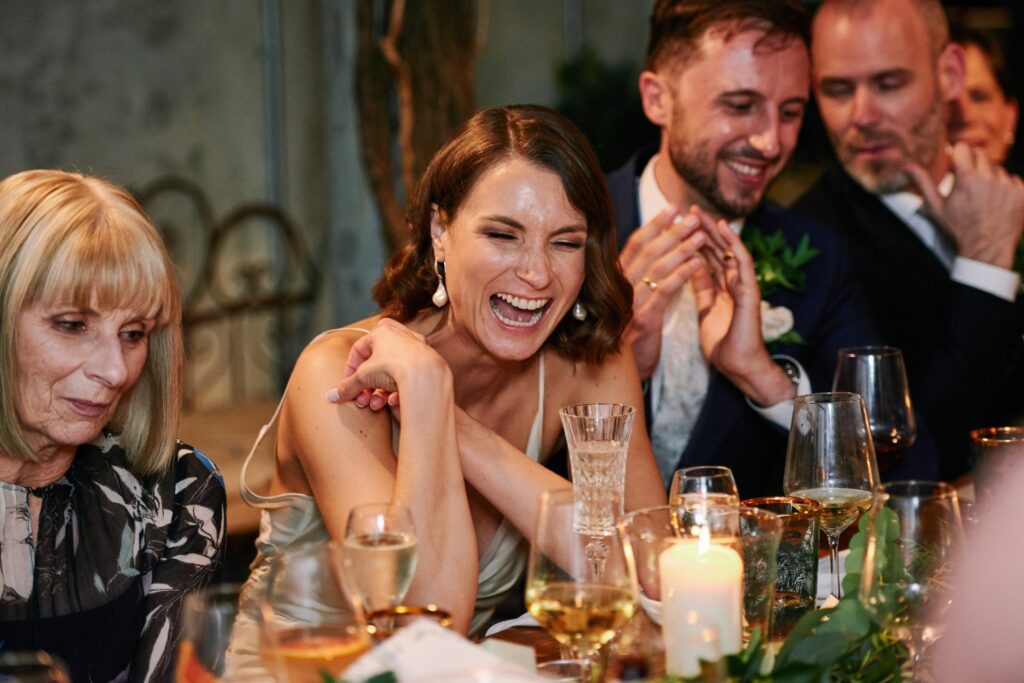 Bride laughing during Italian themed wedding in central London