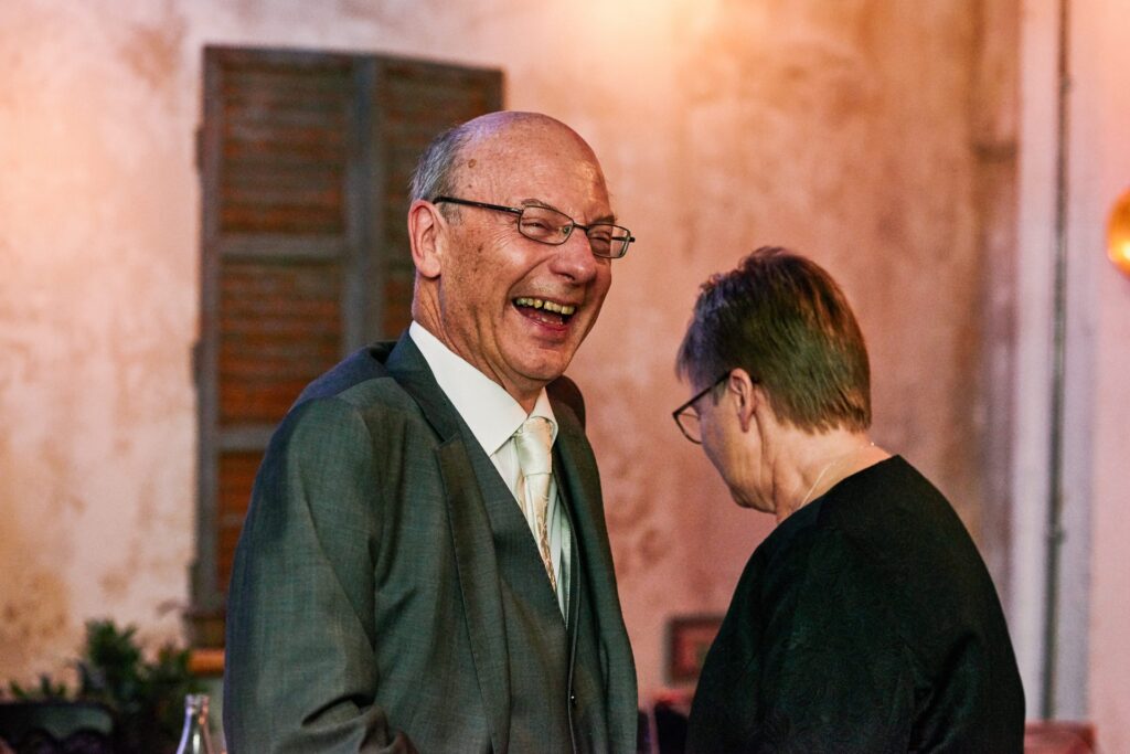 wedding guests laughing during small wedding reception at Union Street Café.