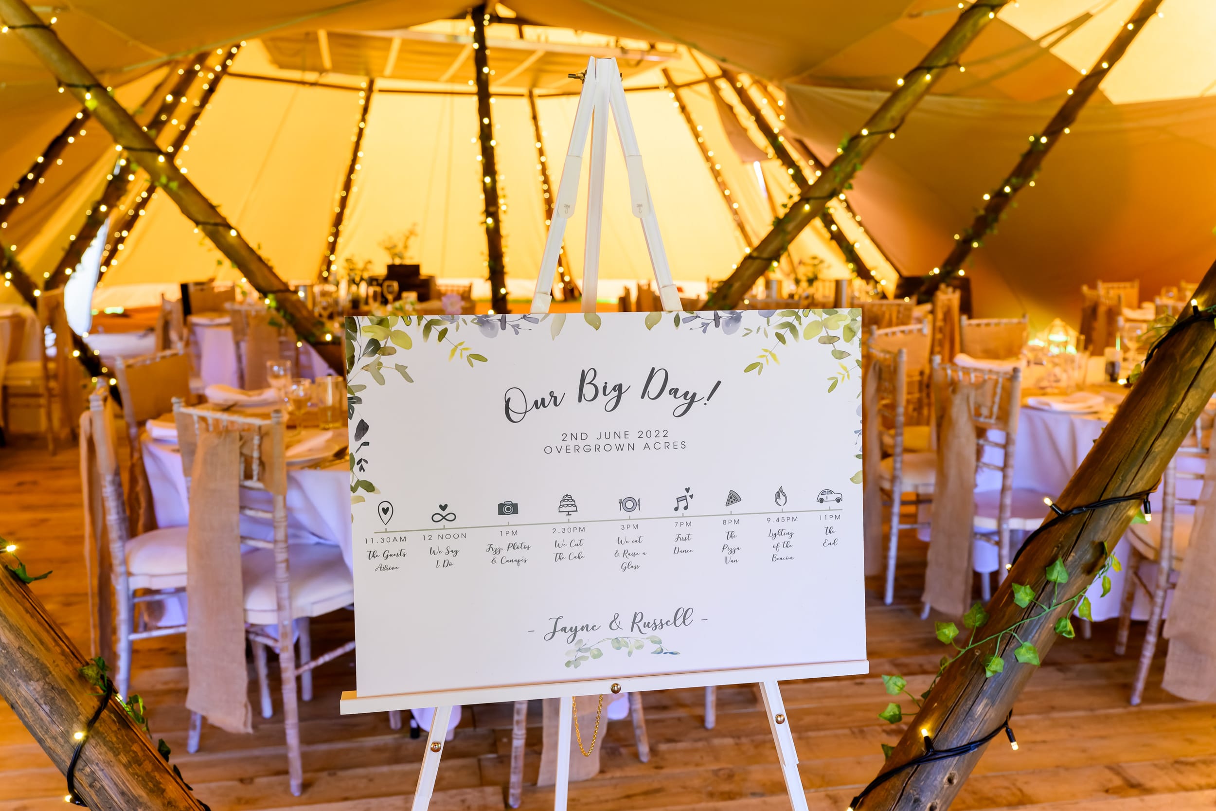 Wedding ceremony sign in front of tipi entrance