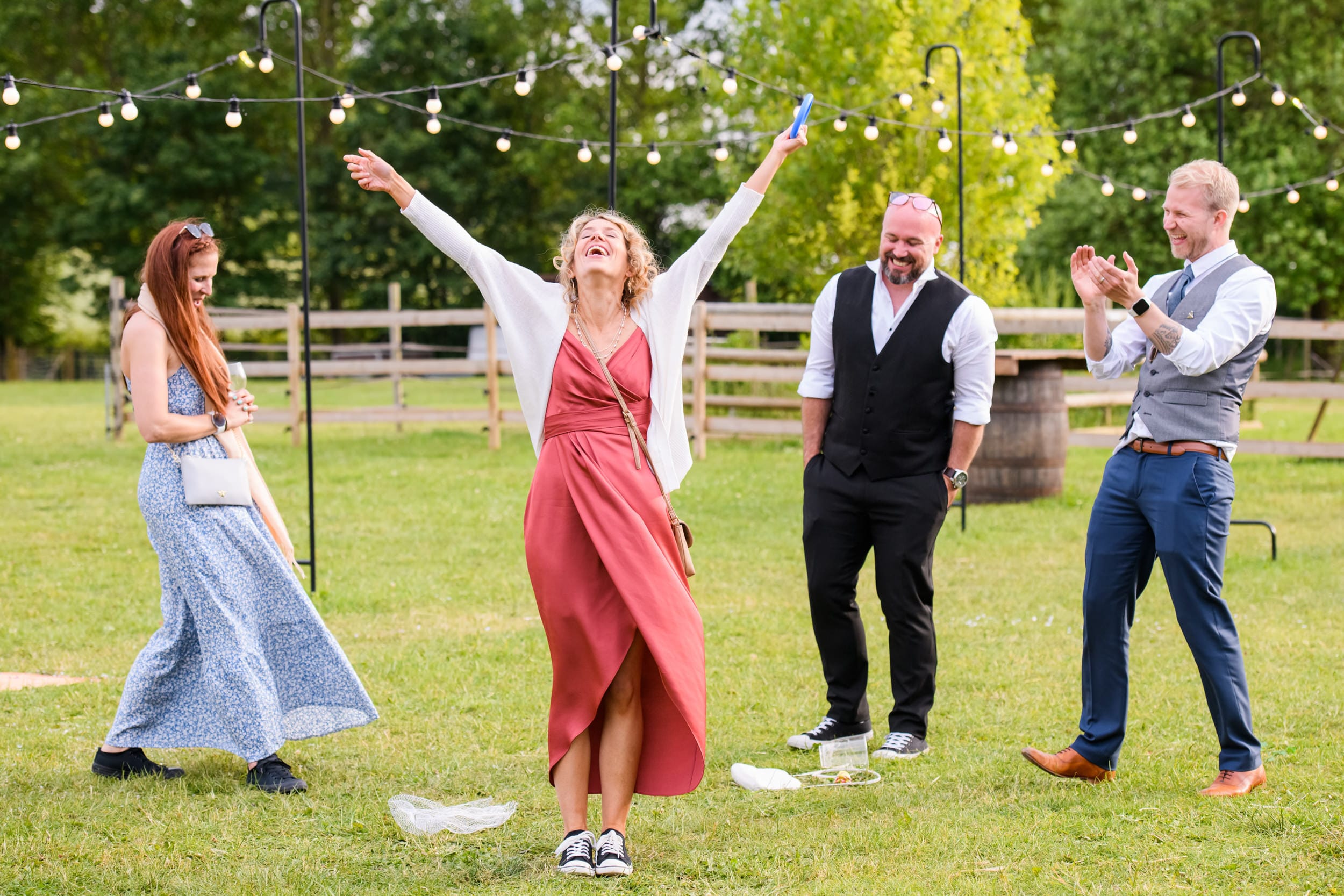 Guests having fun and playing games during festival wedding in Nottingham
