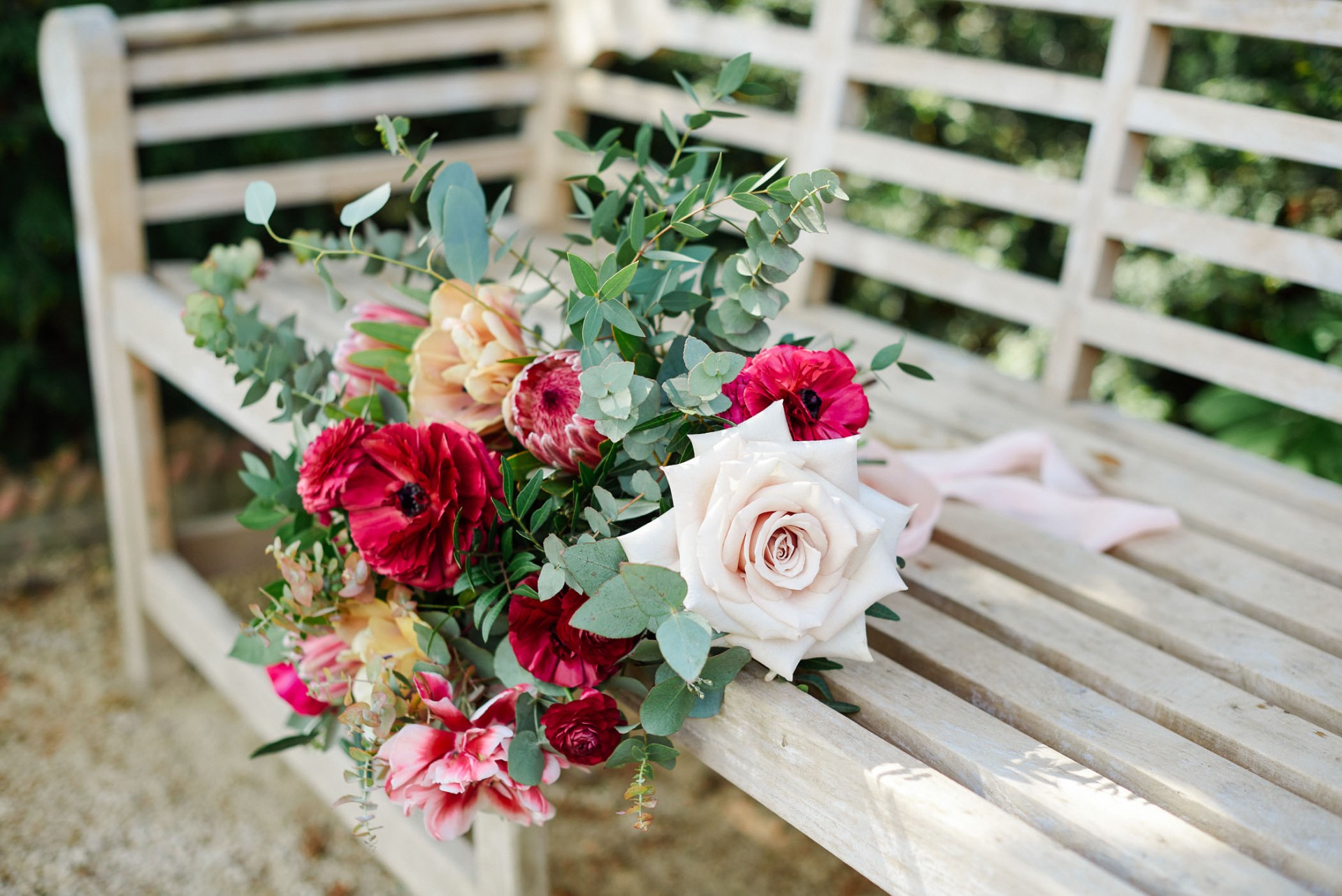 flower bouquet on wooden bench