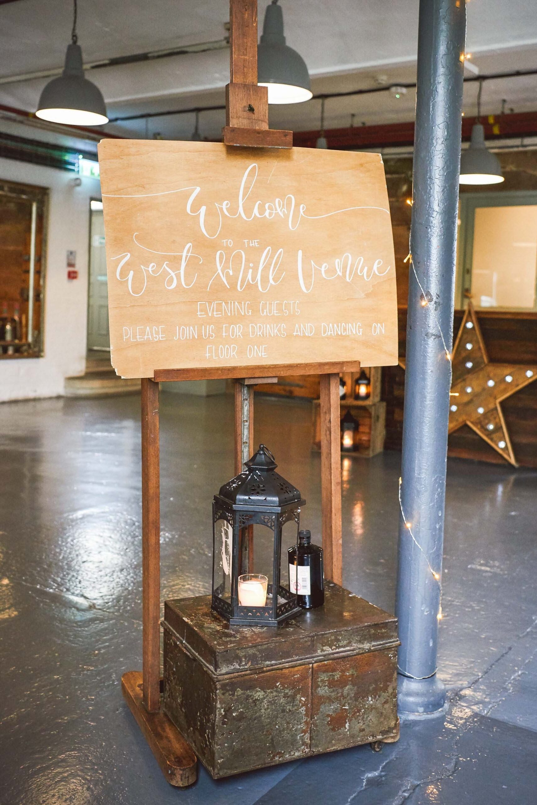 wooden rustic welcome to the west mill wedding sign