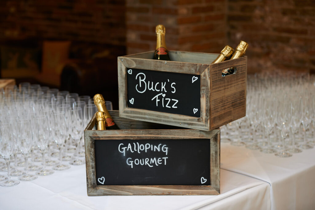 Champagne in wooden boxes ready for guests in the cart barn