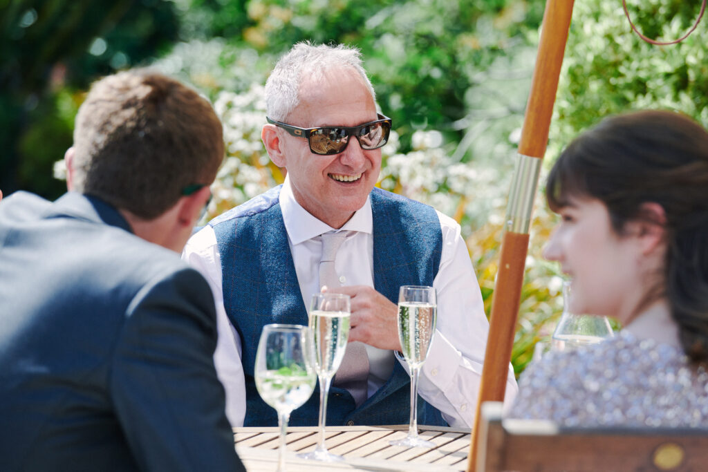 candid photography of a wedding guests laughing at stokes farm barn
