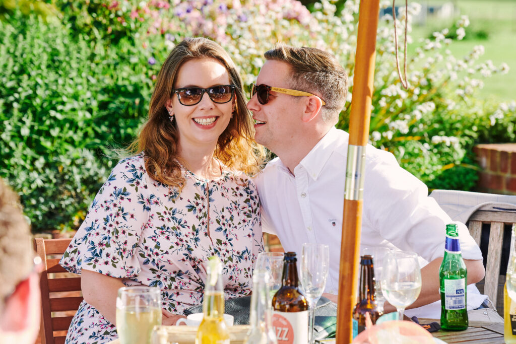 natural wedding photography showing happy guests in the sun