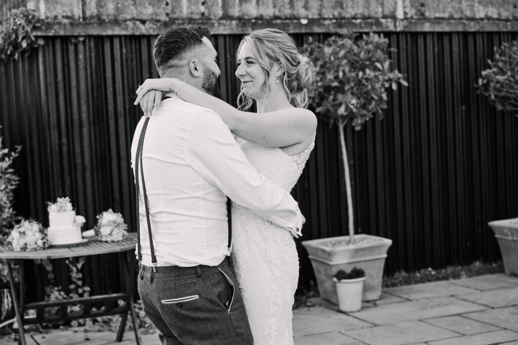 bride and groom during their outdoor first dance at stokes farm barn