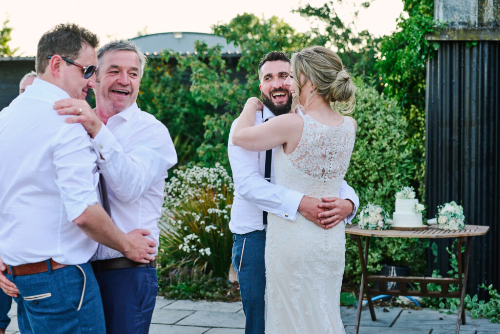 bride and groom dancing together outside at stokes farm barn