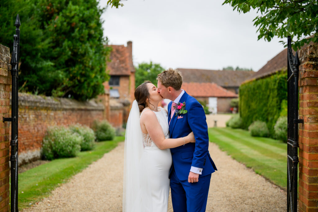 Bride & groom kissing in front of Nottingham wedding venue