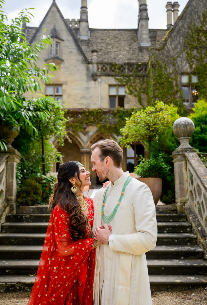 Bride and groom in front of brick house wedding venue