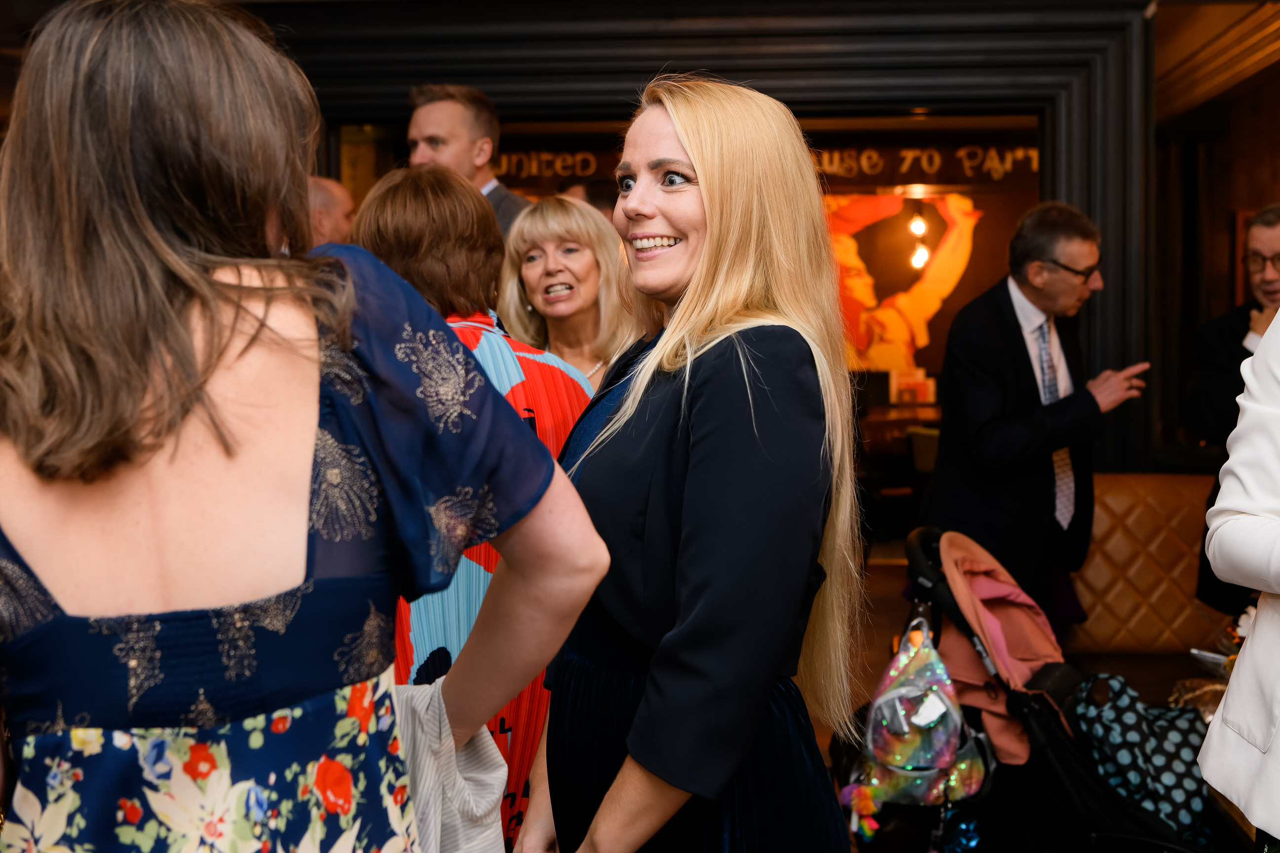 candid photo of happy wedding guest in the Vine Pub