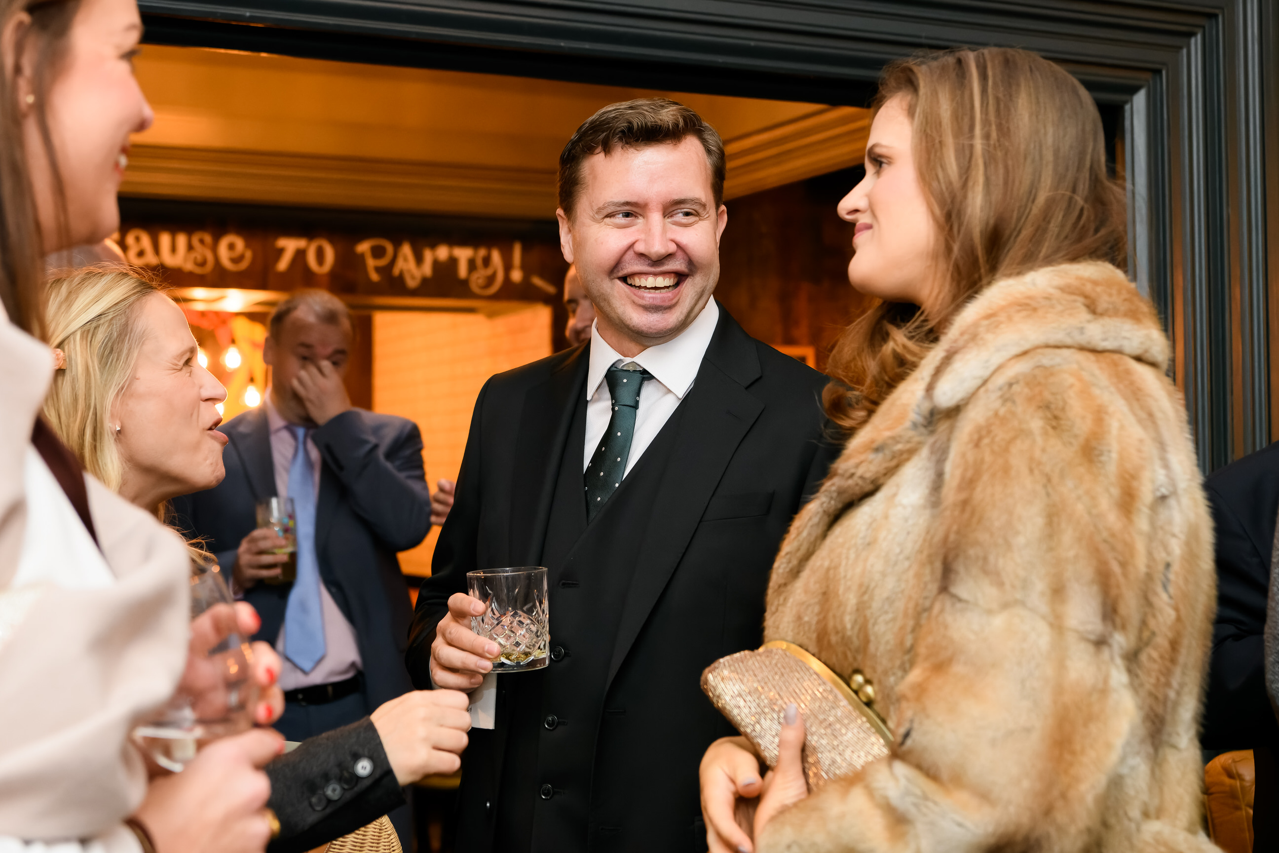 groom laughing in the Vine Pub in Islington