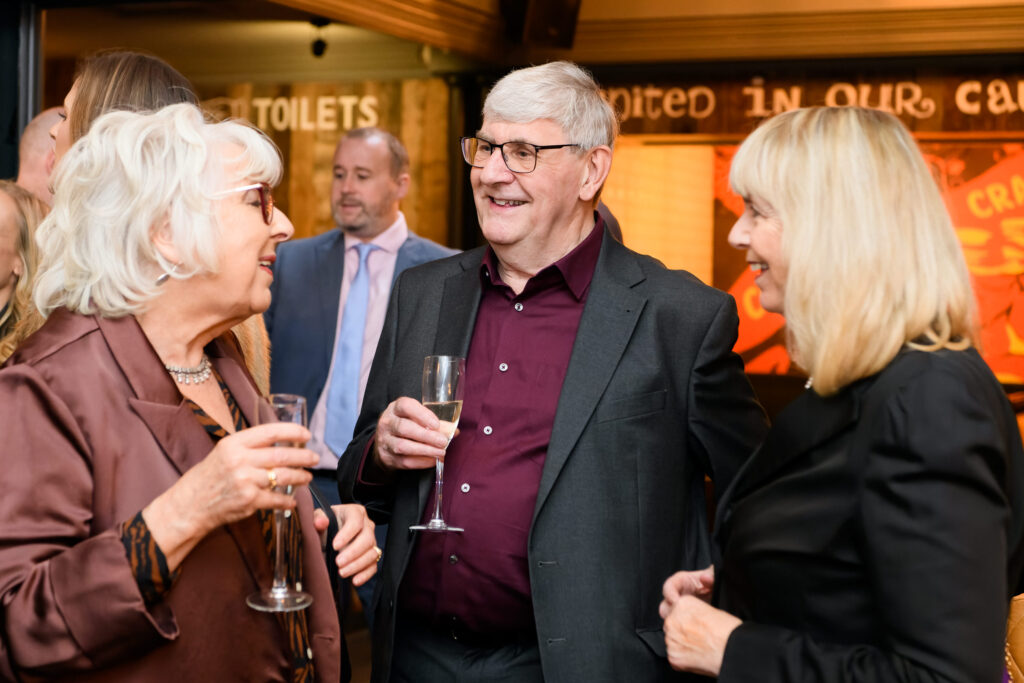 wedding guest laughing in the Vine Pub in Islington