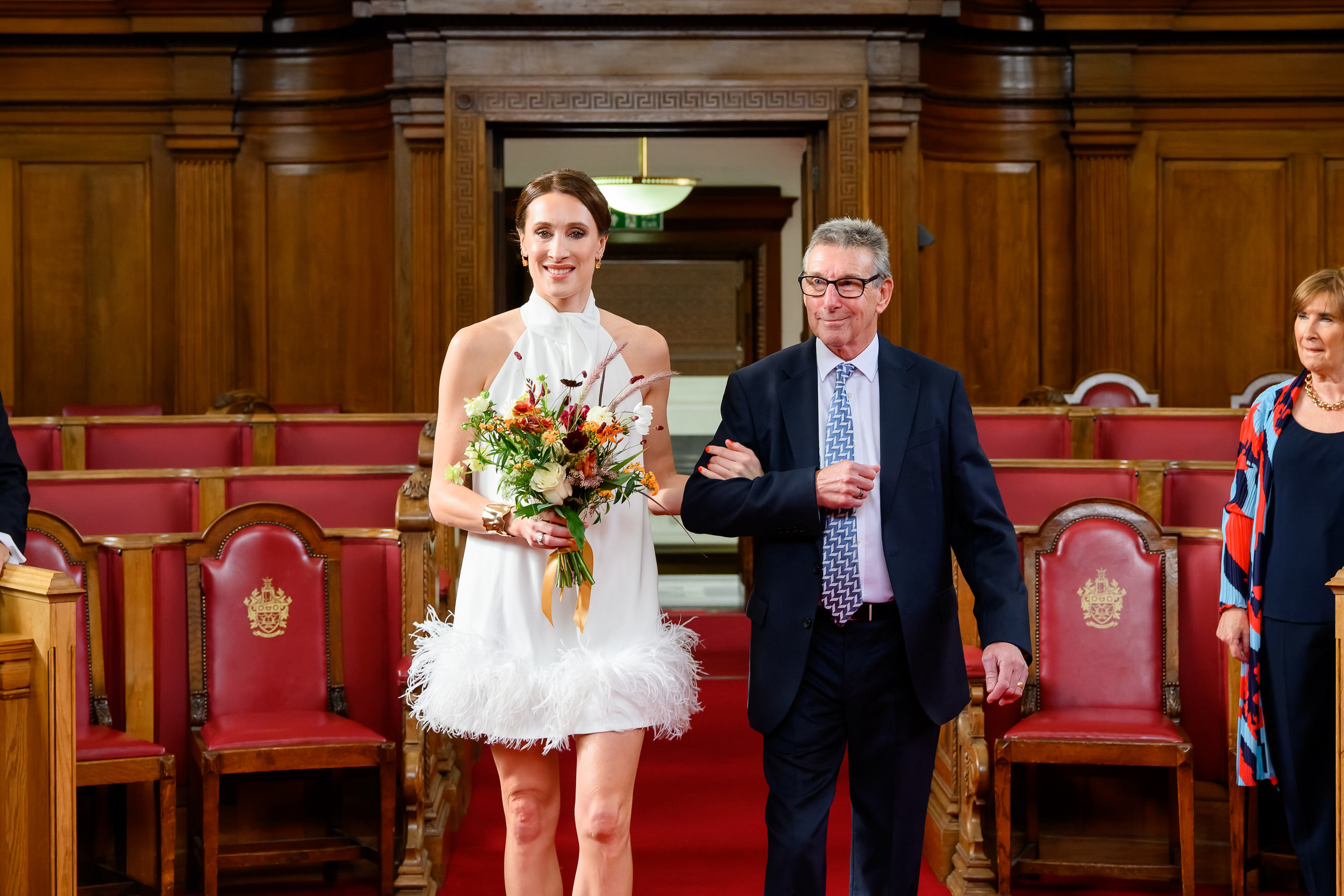 stylish bride walking down the isle with her dad during Islington Town Hall Wedding